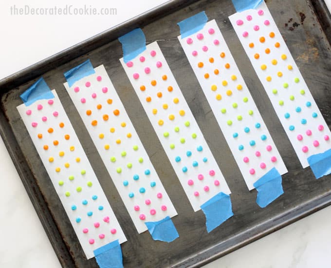 How to make retro homemade candy buttons with colorful royal icing, a copycat recipe of the traditional candy. Great rainbow and unicorn party food! Video how-tos. #RainbowFood #CandyButtons #RetroCandy #CandyDots #Homemade #CopycatRecipe