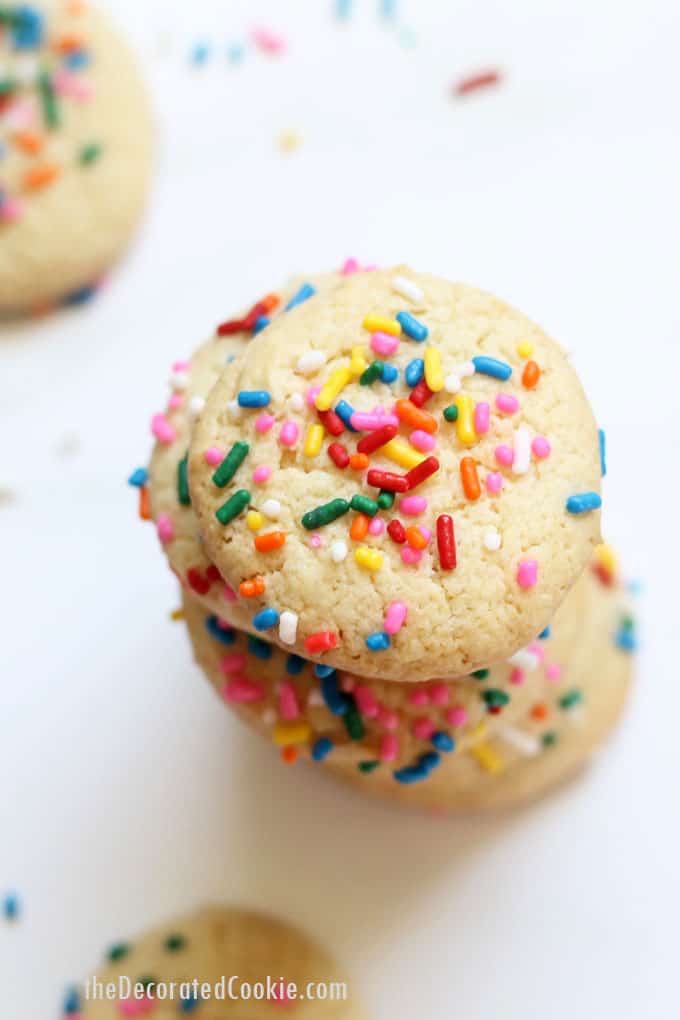 This three-ingredient cake mix cookie recipe topped with sprinkles is a quick, easy, delicious birthday cookie idea! Video recipe included. #CakeMixCookies #Sprinkles #BirthdayCookies 