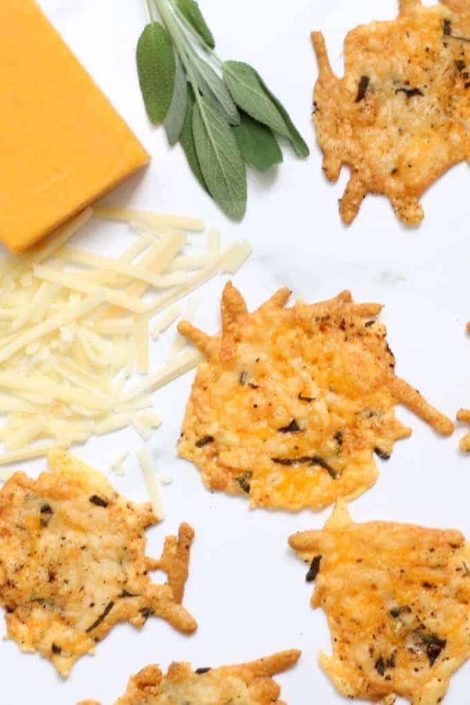 Parmesan crisps with herbs are an easy, low-carb, keto snack and appetizer. Made with only a few ingredients, shredded cheese, pepper, and sage. Video recipe. #ParmesanCrisps #LowCarb #Keto #snacks #appetizers #Cheese #Herbs