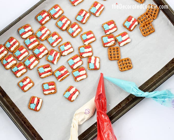 American flag pretzels on baking tray with candy melts in bags 