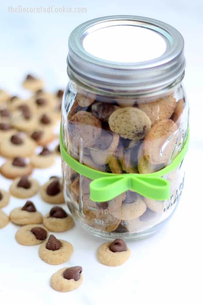 Mini chocolate chip cookies packaged in mason jars are a cute homemade gift idea. These cookies are teeny, tiny, bite-size chocolate chip cookies. #chocolateChipCookies #recipe #minicookies #masonjar