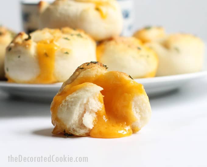 Cheese bombs: Wrap cheese in refrigerated biscuits and bake to make these "grilled cheese" bombs for an EASY lunch or appetizer idea. #Cheese #EasyAppetizer #2ingredient #refrigeratedbiscuts 