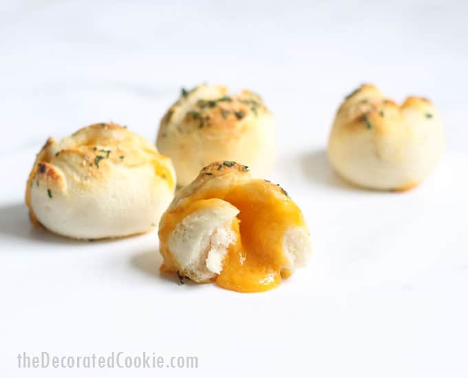 Cheese bombs: Wrap cheese in refrigerated biscuits and bake to make these "grilled cheese" bombs for an EASY lunch or appetizer idea. #Cheese #EasyAppetizer #2ingredient #refrigeratedbiscuts 
