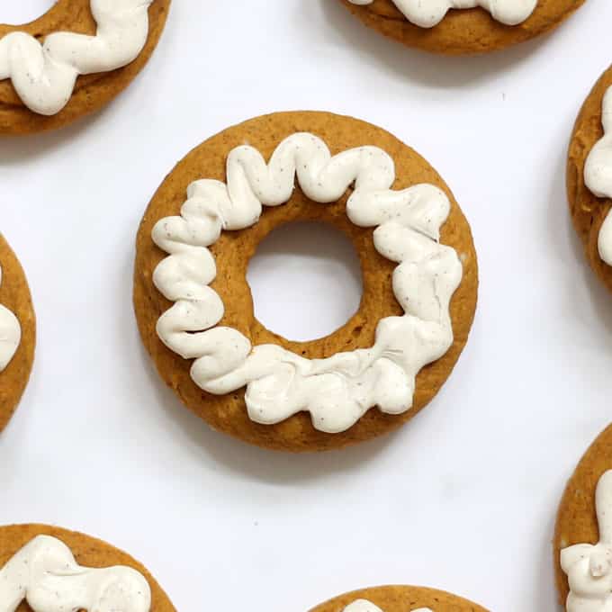 These 2-ingredient pumpkin donuts, baked, not fried, are so easy to make with cake mix and pumpkin puree. A perfect treat for fall and Halloween. #pumpkin #donuts #doughnuts #fall #Halloweendesserts #falldesserts #pumpkindonuts #doughnuts #2ingredient