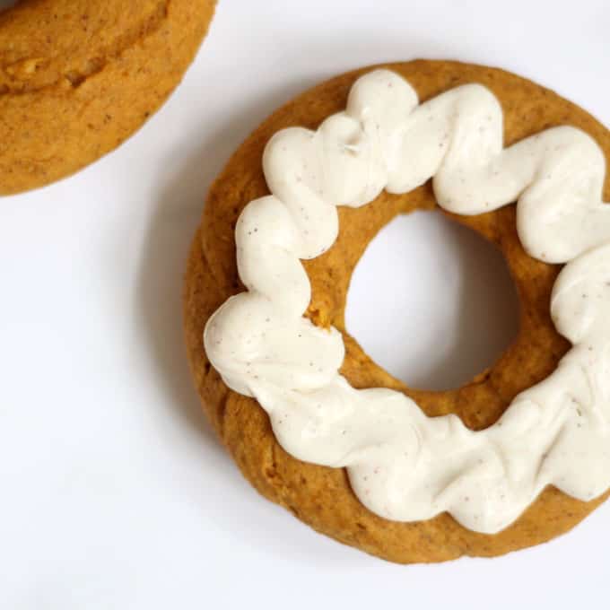 These 2-ingredient pumpkin donuts, baked, not fried, are so easy to make with cake mix and pumpkin puree. A perfect treat for fall and Halloween. #pumpkin #donuts #doughnuts #fall #Halloweendesserts #falldesserts #pumpkindonuts #doughnuts #2ingredient