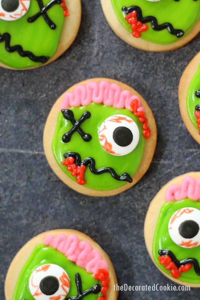 ZOMBIE COOKIES! Mini zombie cookies are the perfect Halloween treat or Halloween party favor and dessert. Easy to decorate, video recipe. #halloween #partyfood #cookiedecorating #zombies #zombiecookies 