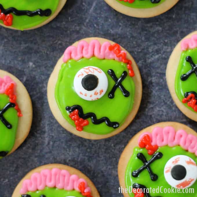 ZOMBIE COOKIES! Mini zombie cookies are the perfect Halloween treat or Halloween party favor and dessert. Easy to decorate, video recipe. #halloween #partyfood #cookiedecorating #zombies #zombiecookies 