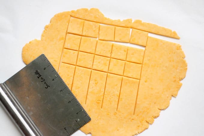 Homemade Cheez-its, filled with real cheddar cheese and baked to a crisp, are even better than the store-bought crackers. #homemade #crackers #storebought #copycat #snacks #cheezits #homemadecheezits #cheese