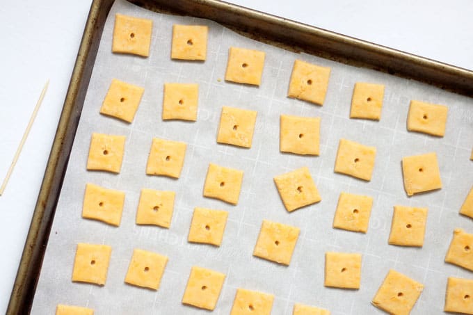 Homemade Cheez-its, filled with real cheddar cheese and baked to a crisp, are even better than the store-bought crackers. #homemade #crackers #storebought #copycat #snacks #cheezits #homemadecheezits #cheese