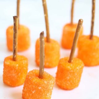 These "pumpkin" marshmallows are so easy to make for a Fall treat. Cute packaging makes them a perfect fall fest or school bake sale dessert. #falltreat #falldessert #pumpkin #marshmallows #fallfest #bakesale #schoolbakesale #halloween