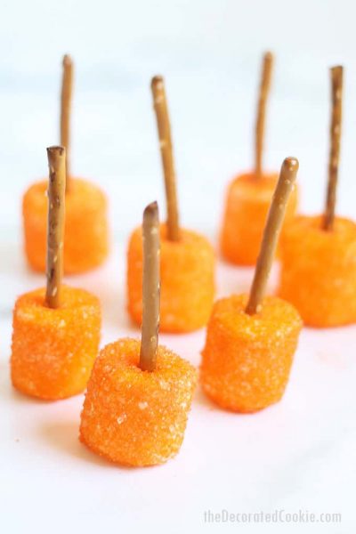 marshmallows with orange sprinkles and pretzel