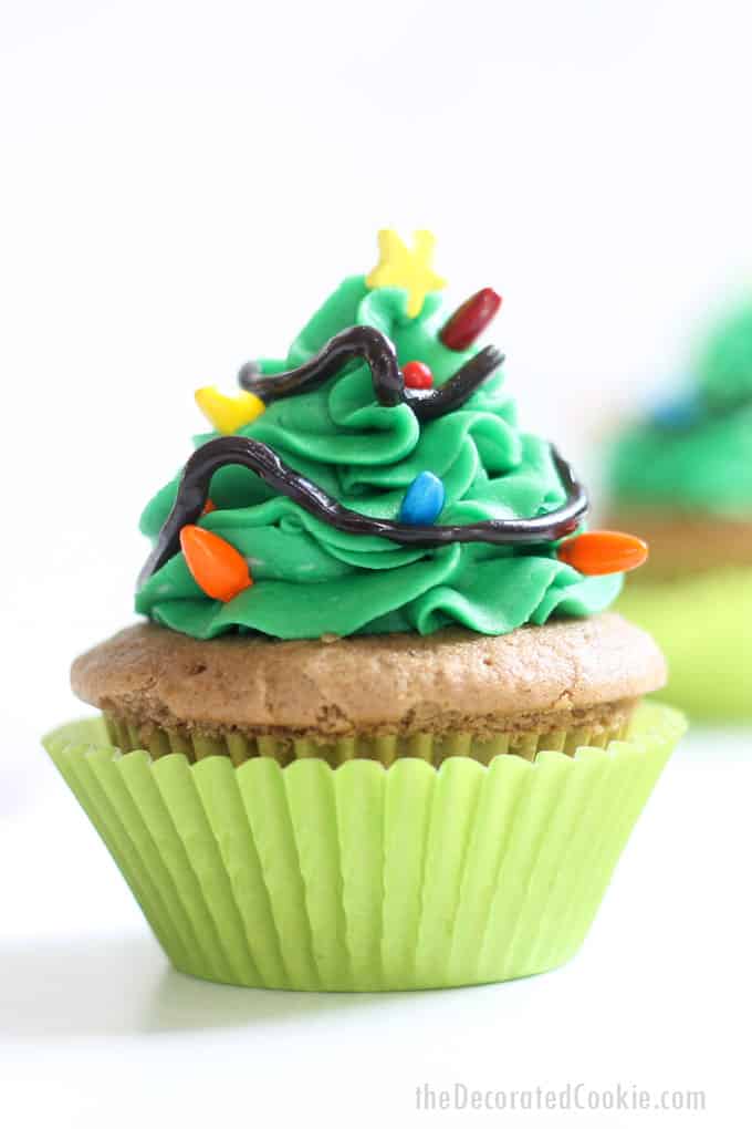 CHRISTMAS TREE CUPCAKES -- topped with green frosting and sprinkles are an easy Christmas cupcake idea using Wilton icing decorations.