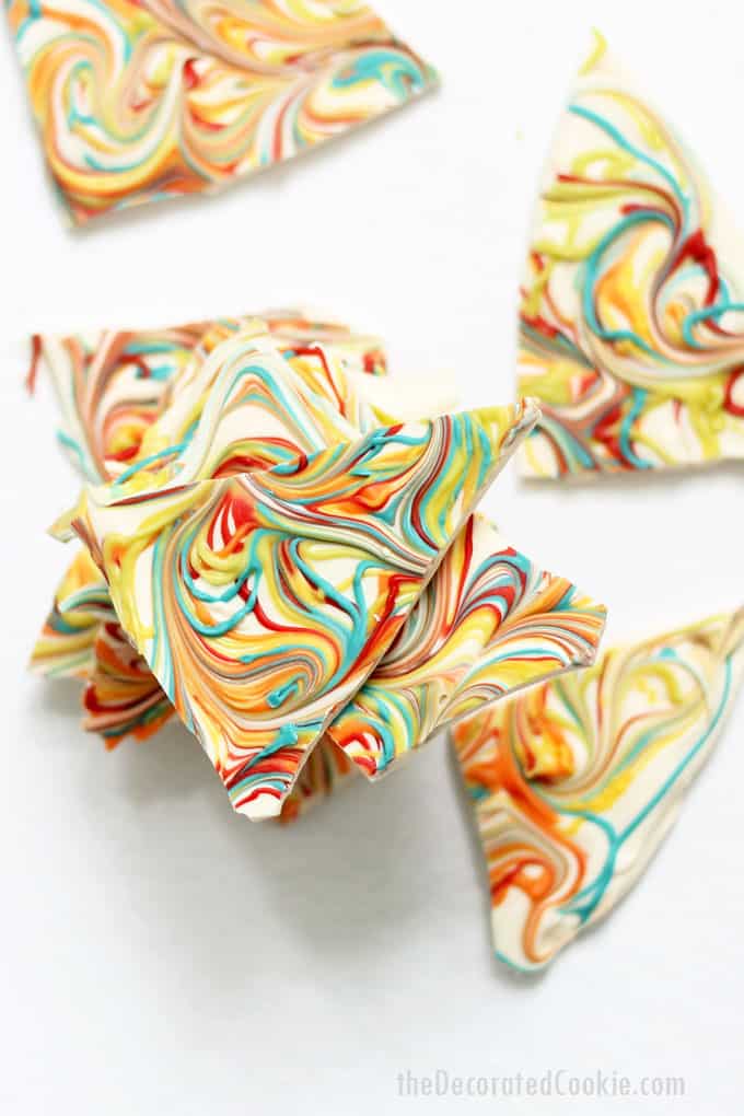 RAINBOW CHOCOLATE BARK-- swirls of colorful candy in white chocolate for a delicious ,easy, no-bake dessert for St. Patrick's Day or a rainbow party.