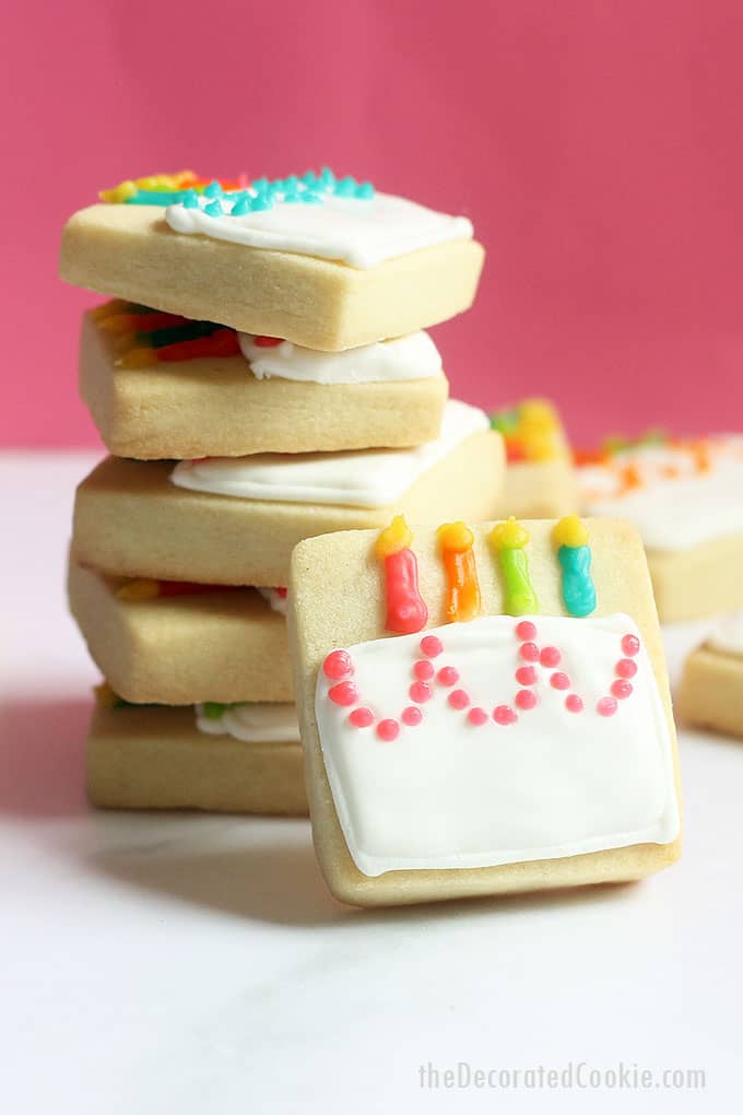 MINI BIRTHDAY CAKE COOKIES -- A cute decorated cookie idea for a homemade birthday gift idea or birthday party favors. Royal icing and square cookies.
