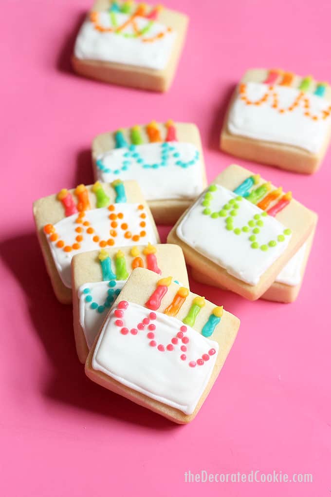 MINI BIRTHDAY CAKE COOKIES -- A cute decorated cookie idea for a homemade birthday gift idea or birthday party favors. Royal icing and square cookies.