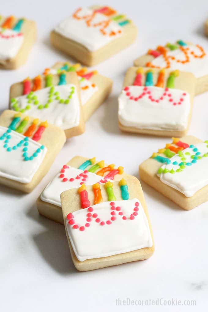 MINI BIRTHDAY CAKE COOKIES -- A cute decorated cookie idea for a homemade birthday gift idea or birthday party favors. Royal icing and square cookies.