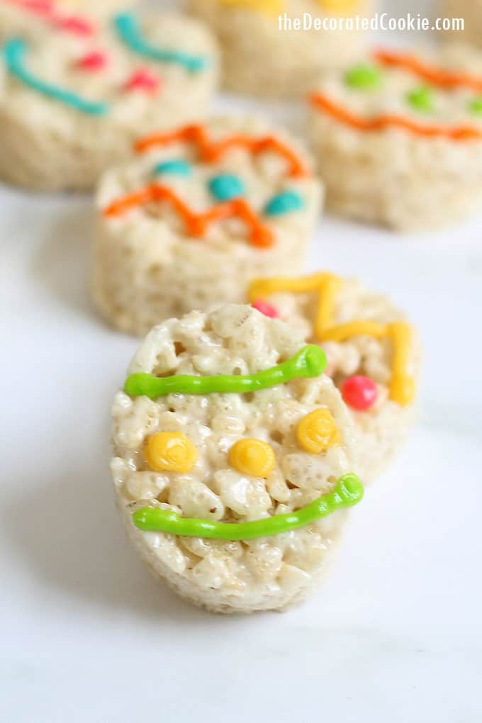 EASTER EGG RICE KRISPIE TREATS with white chocolate -- Easy, no-bake Easter dessert. Cut out oval cereal treats and decorate with royal icing.