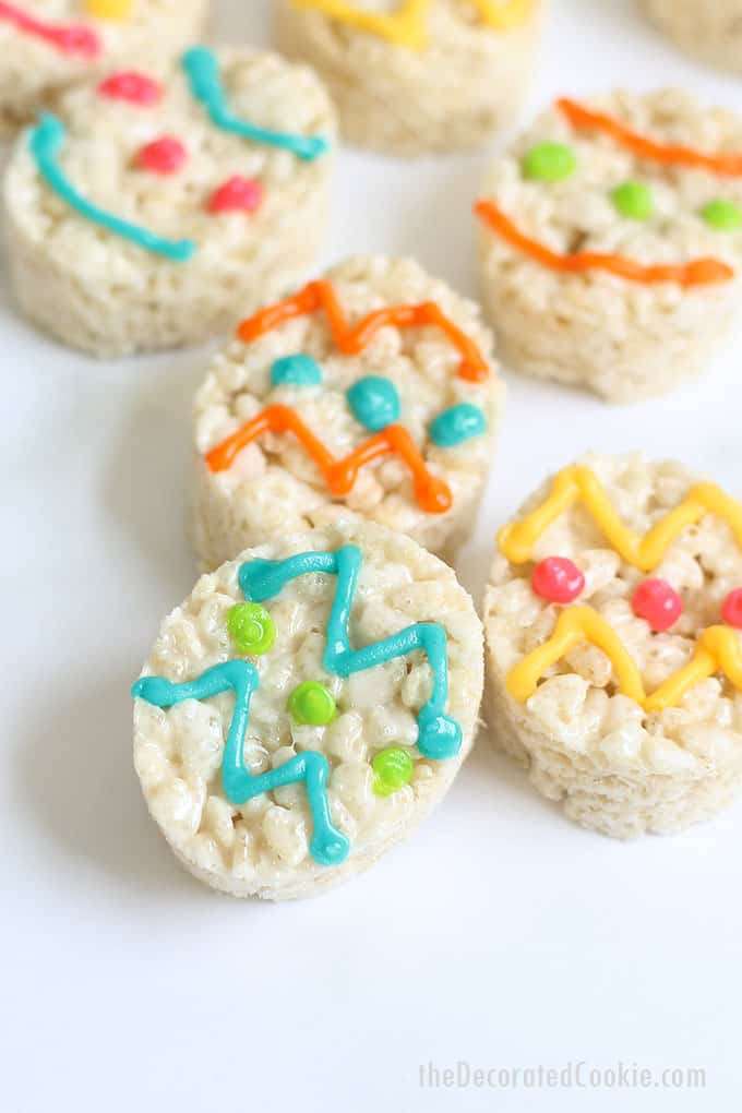 EASTER EGG RICE KRISPIE TREATS with white chocolate -- Easy, no-bake Easter dessert. Cut out oval cereal treats and decorate with royal icing.