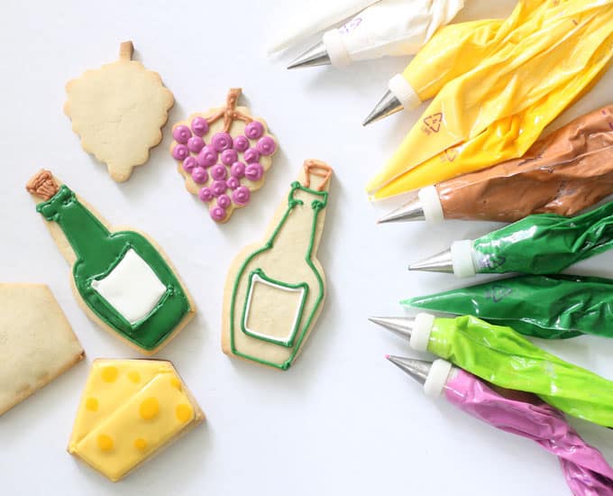 decorating wine and cheese cookies with royal icing bags 