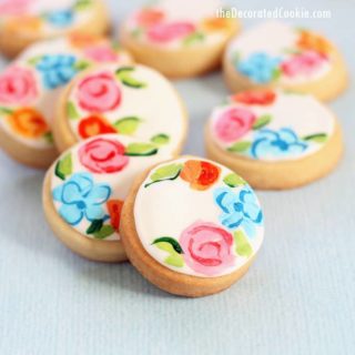 painted flower cookies on blue background