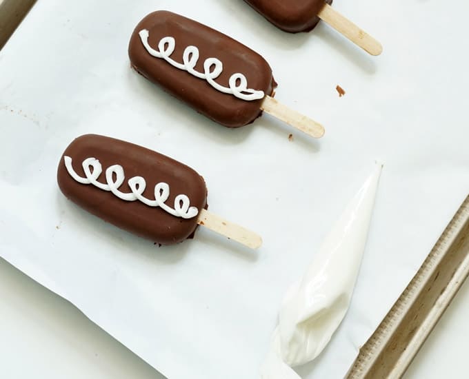 icing piped on "Hostess" cakesicles