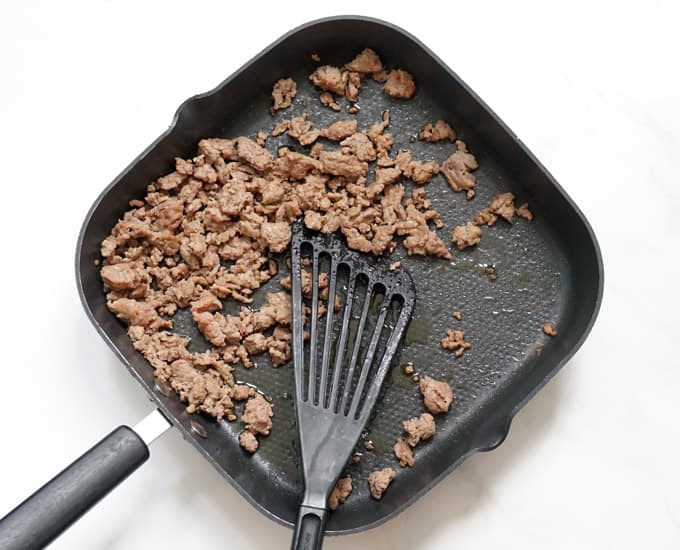 browning beef and sausage in skillet