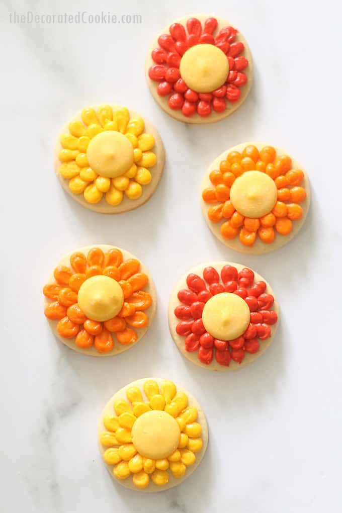 overhead image of piped flower cookies for fall