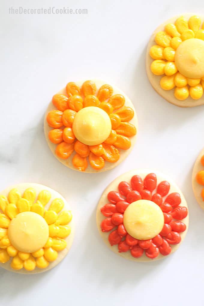 overhead image of piped flower cookies for fall 
