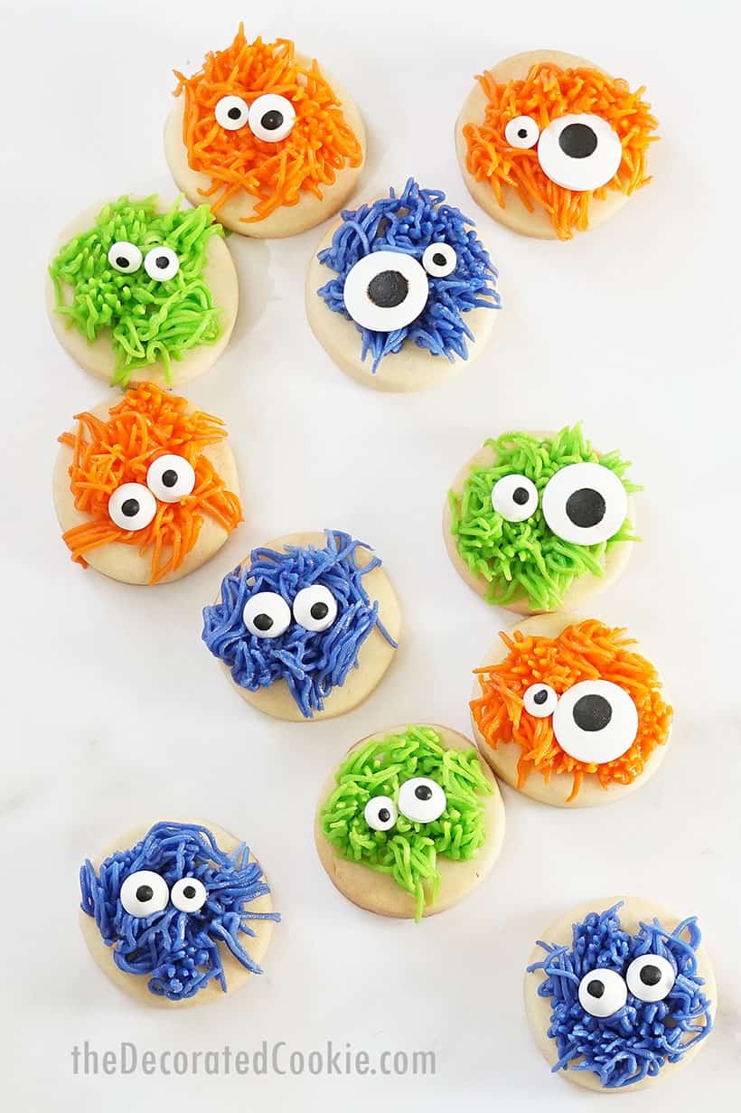 fuzzy monster Halloween cookies made with frosting on bite-size circle cookies