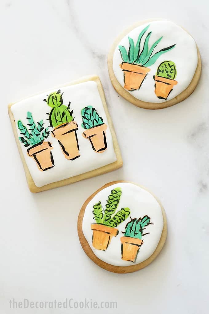 overhead view of painted succulent cookies 