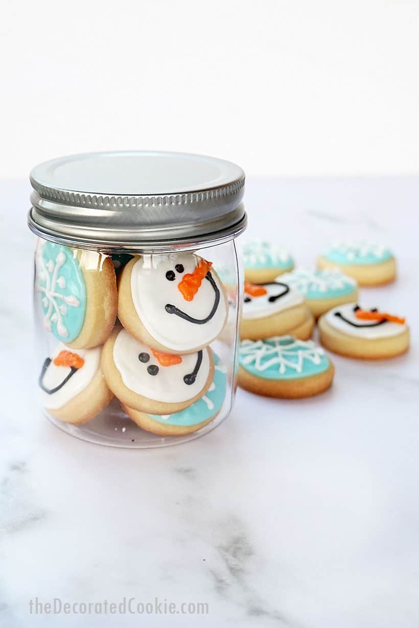 mini snowman and snowflake decorated cookies for winter and Christmas 