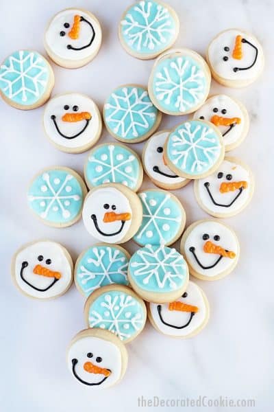 mini snowman and snowflake decorated cookies for winter and Christmas