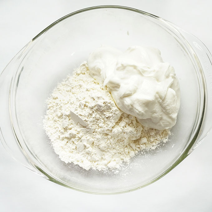 self-rising flour and greek yogurt in a bowl to make air fryer bagels 