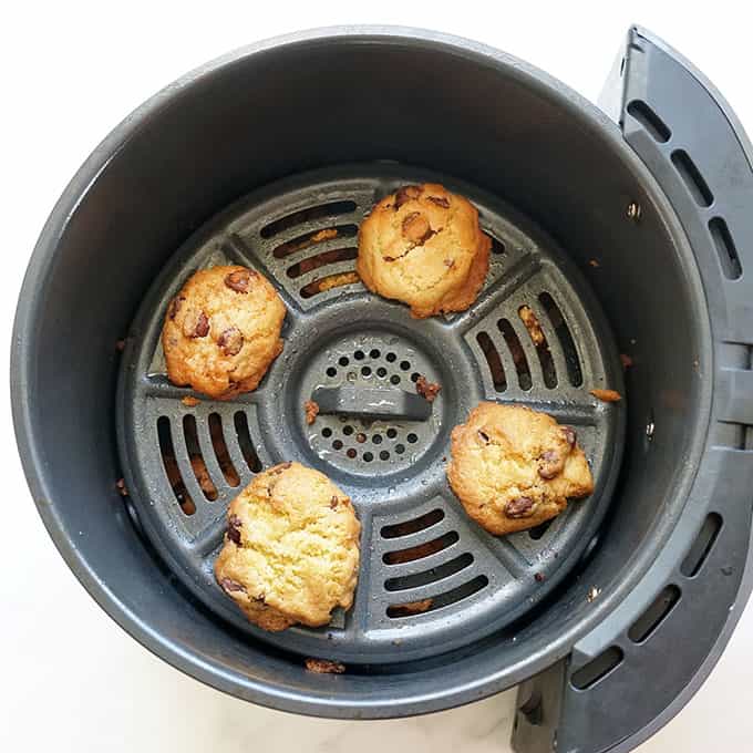 air fryer chocolate chip cookies in air fryer basket 