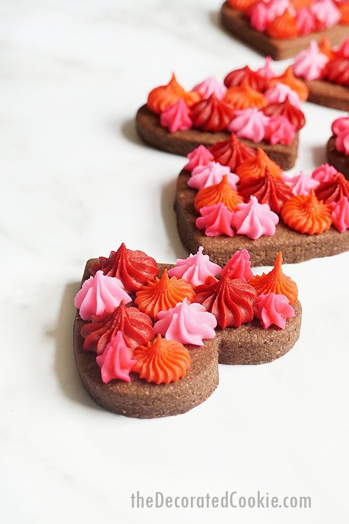 close up image of Valentine's Day chocolate cookie hearts with frosting