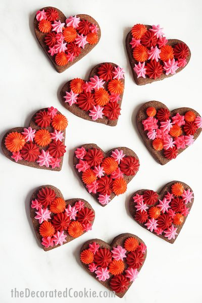 overhead image of Valentine's Day chocolate cookie hearts with frosting