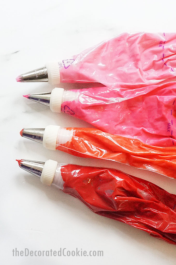 red and pink frosting bags