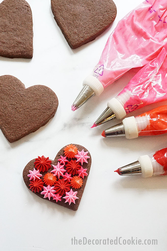 red and pink frosting bags with chocolate heart cookies