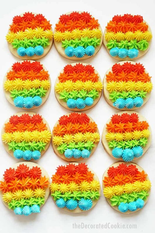 RAINBOW COOKIES piped with frosting and decorating tips for Pride.